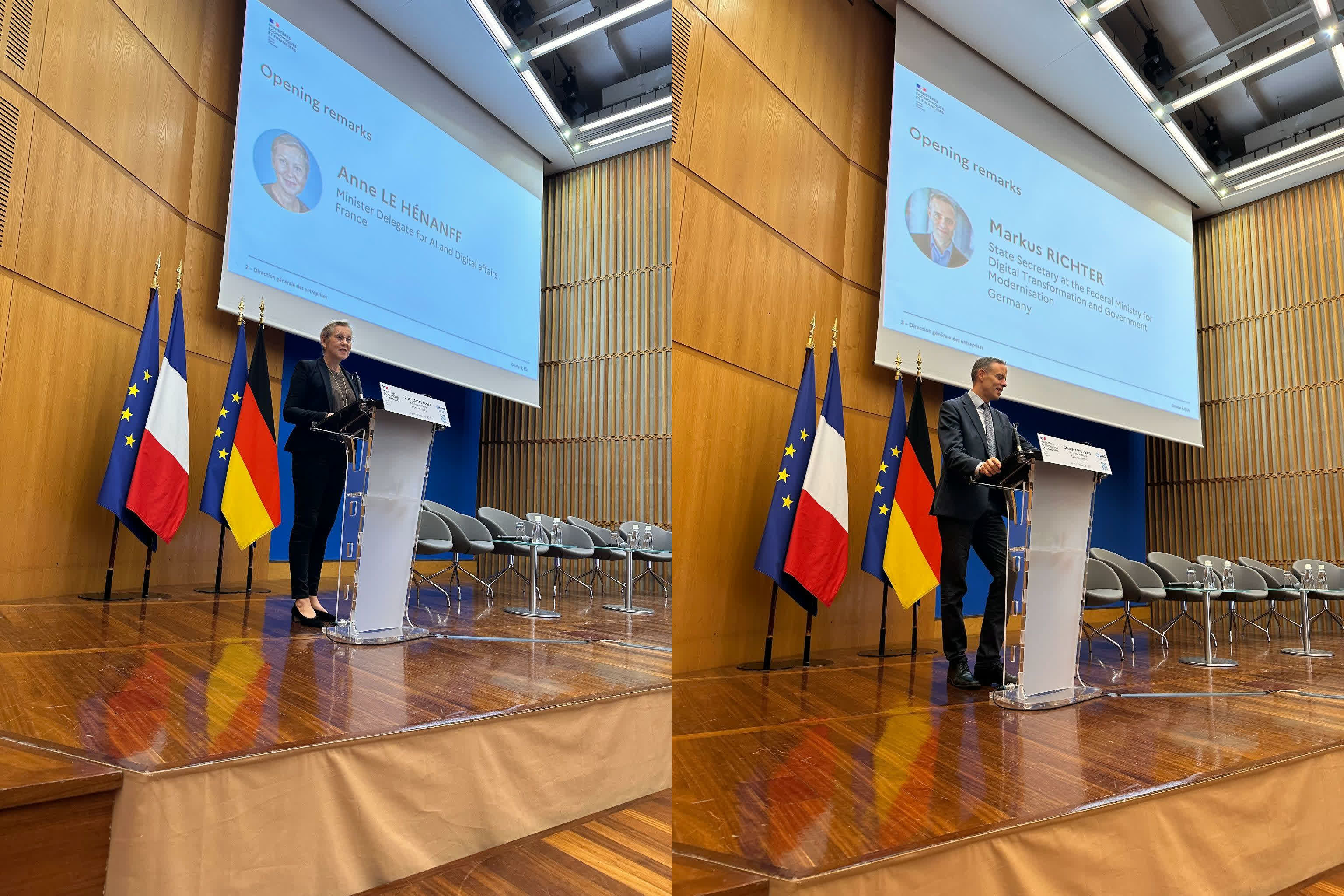 French Minister Delegate Anne Le Henanff and German State Secretary Markus Richter are delivering their opening remarks on a stage in front of German, French, and European flags. There is a projection surface behind them with details about their person.